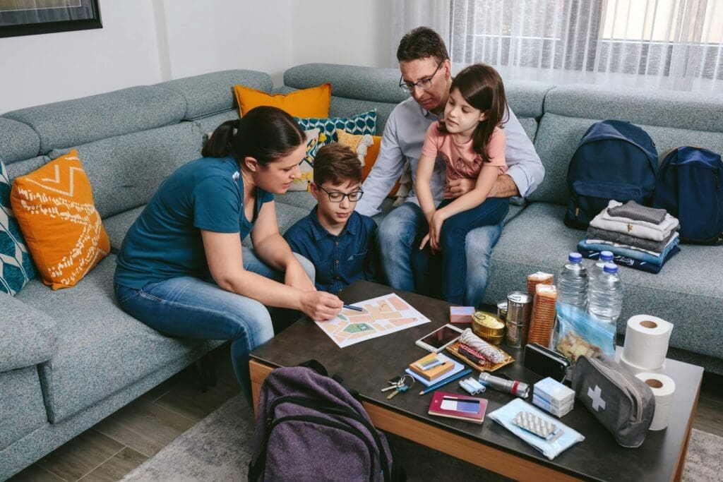 Mother explaining to her family how to build a First Aid Kit